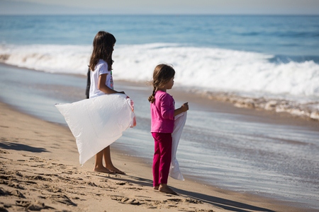 Young girls volunteer at cleanup
