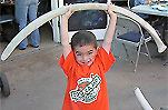 Child holding whale bone