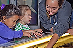Children at the Aquarium touch tanks