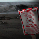 Beach closure sign - Action Alert: Restore EPA Beach Monitoring Funding